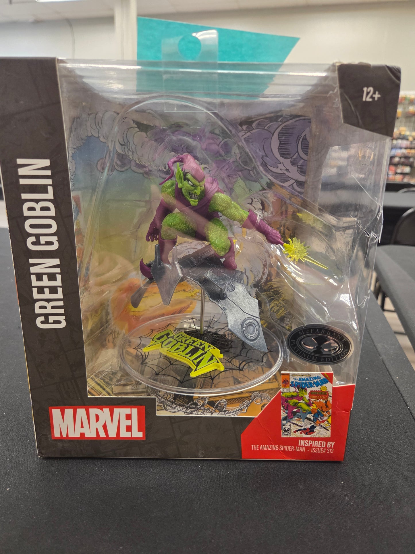 Marvel Green Goblin action figure in packaging on a gray surface